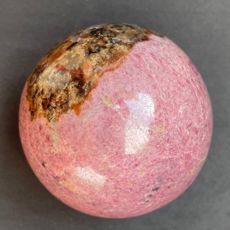 Plum-Toned Rhodonite Sphere 1.13 Lb
